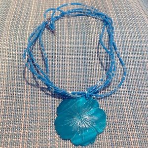 Turquoise shell necklace with beaded strand